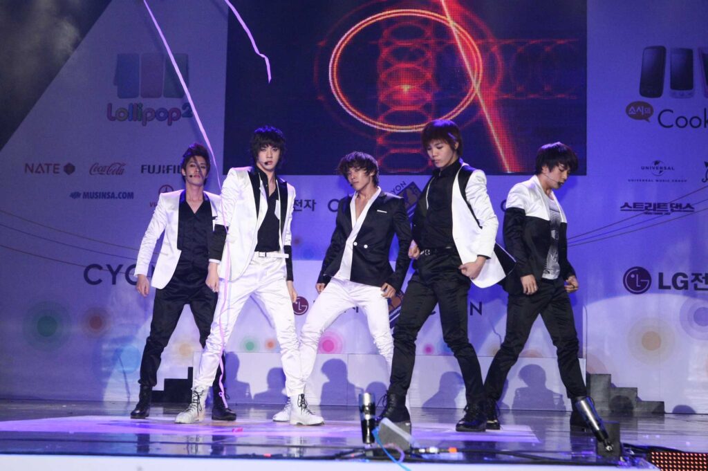 K-POP group MBLAQ performing "Y"—an instance of black & white style